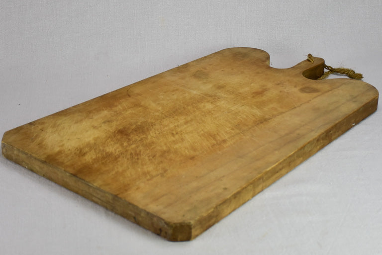 Very large antique French cutting board with round shoulders and handle 25¼" x 16½"