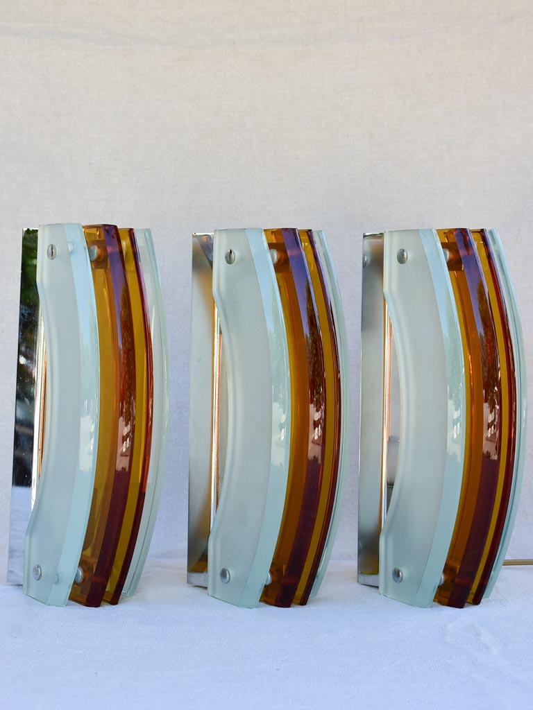 Set of three amber and pale blue glass wall sconces from the 1970's 13"