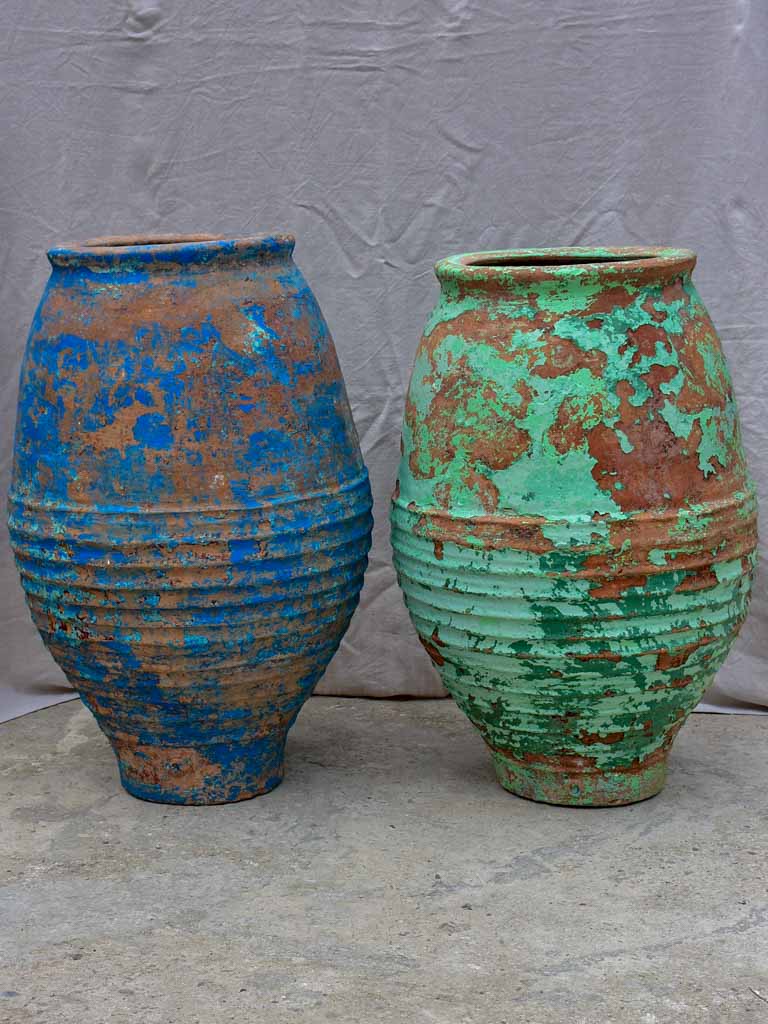 Two very large antique Spanish olive oil jars - blue and green