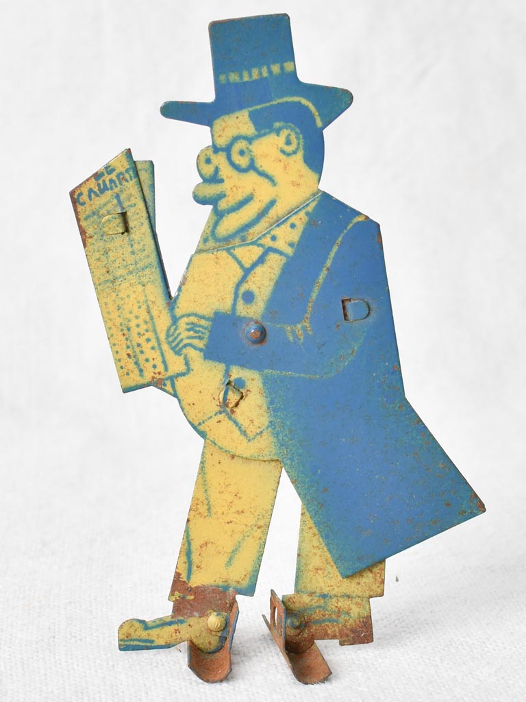 1930s tole figure of a man with a newspaper 4¼"