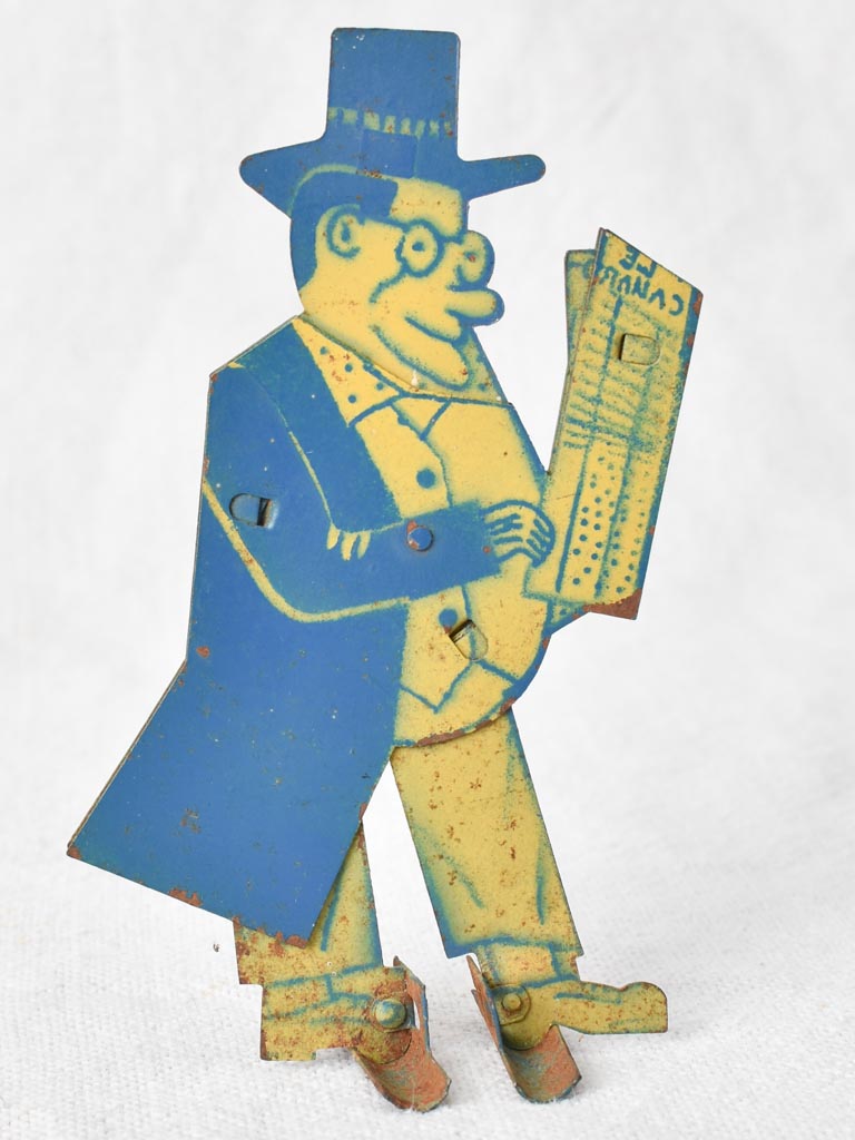 1930s tole figure of a man with a newspaper 4¼"