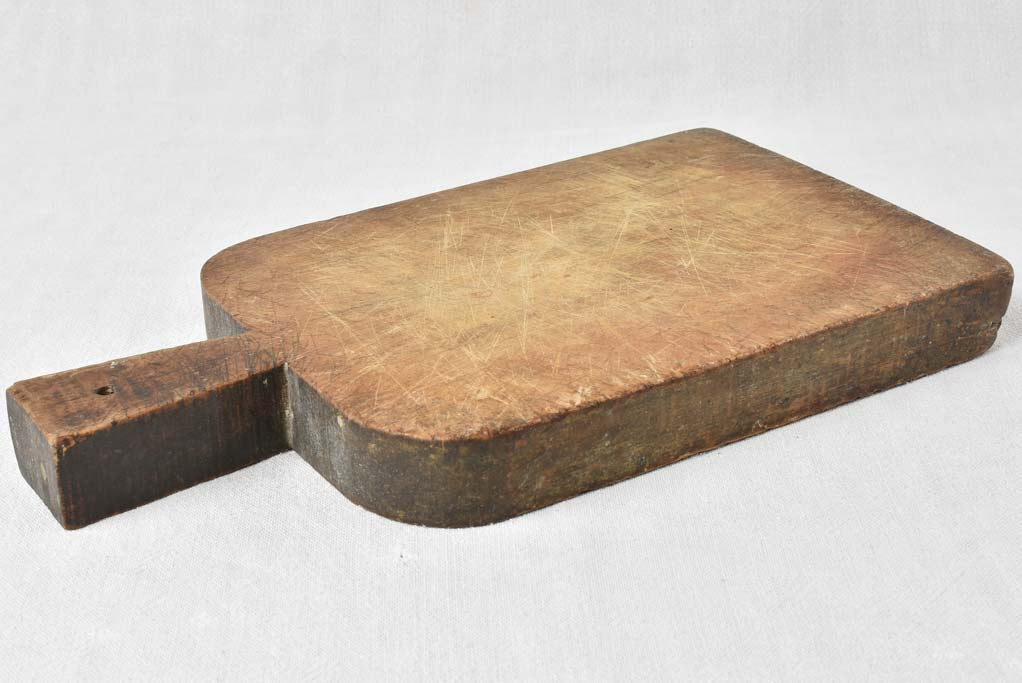 Antique French cutting board with rounded shoulders 17" x 9"