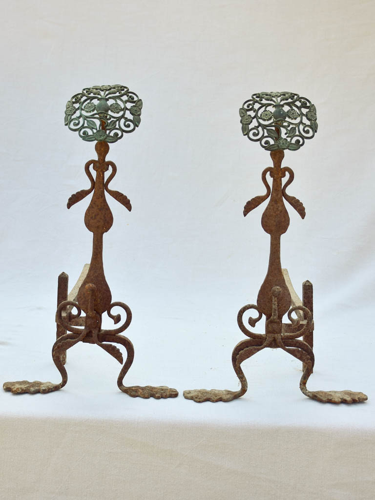 Pair of eighteenth-century French firedogs with oak leaves and floral motifs