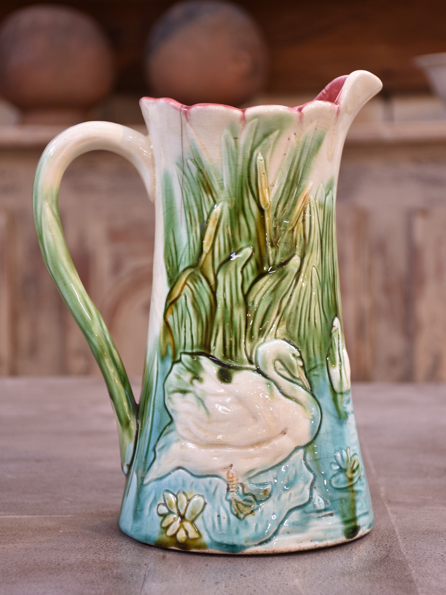 Antique Barbotine Majolica jug with bathing swans