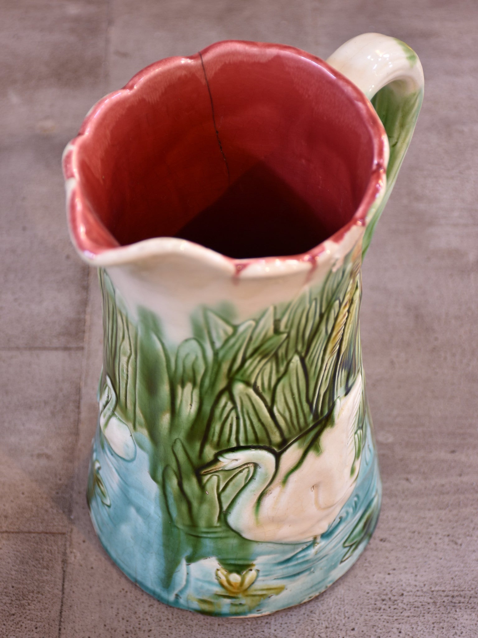 Antique Barbotine Majolica jug with bathing swans