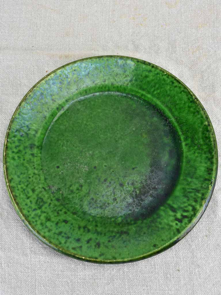 Collection of three early twentieth century green bowls and one green plate