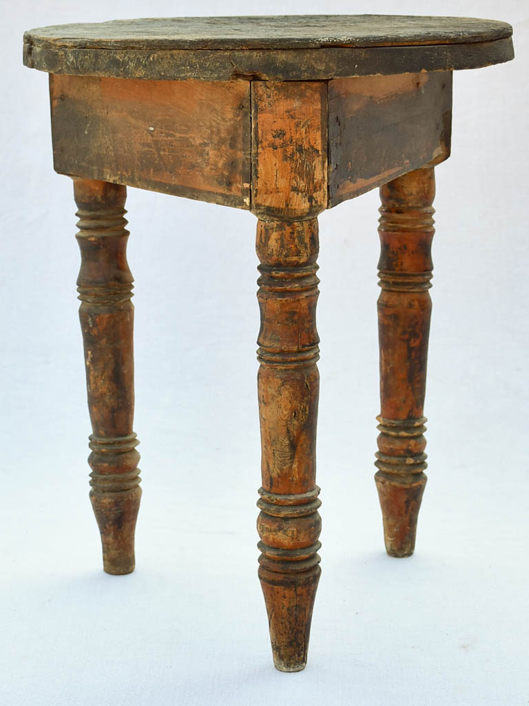 Small antique wooden side table with three legs