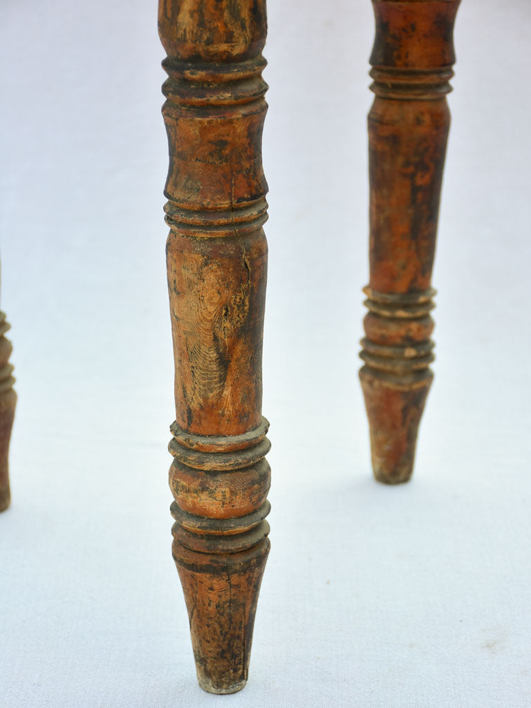 Small antique wooden side table with three legs