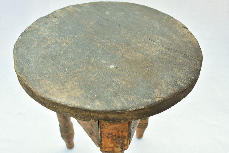 Small antique wooden side table with three legs