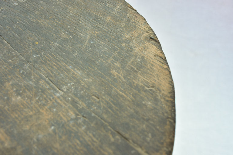 Small antique wooden side table with three legs