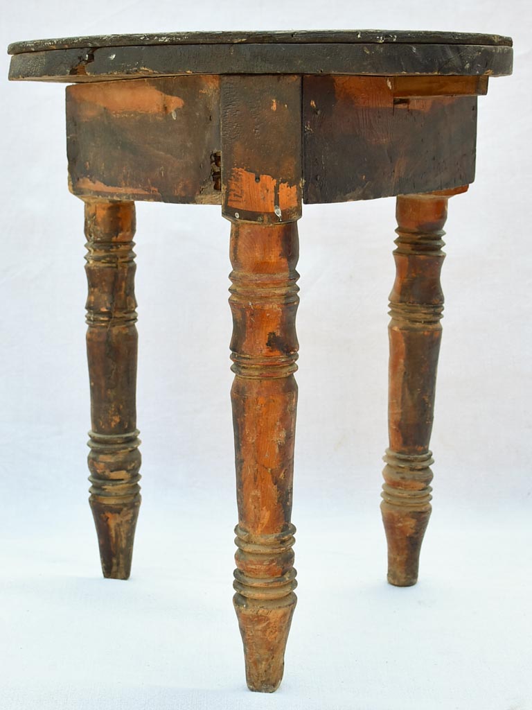 Small antique wooden side table with three legs