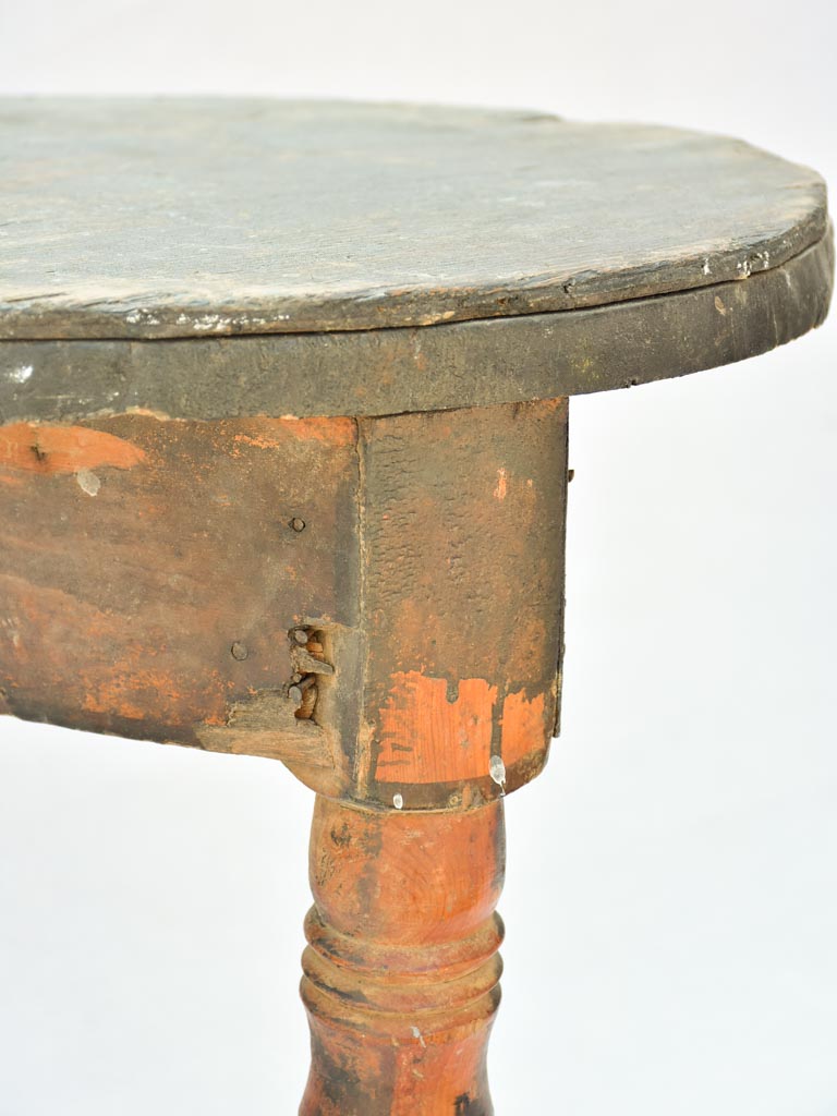 Small antique wooden side table with three legs