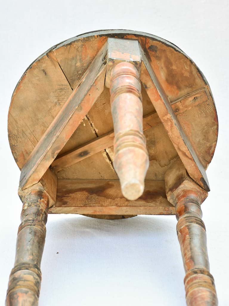 Small antique wooden side table with three legs