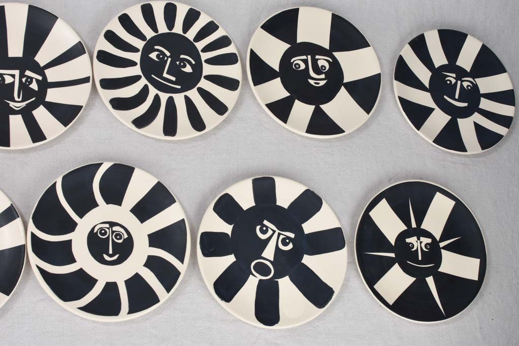 12 plates, beige & black, abstract faces 9"