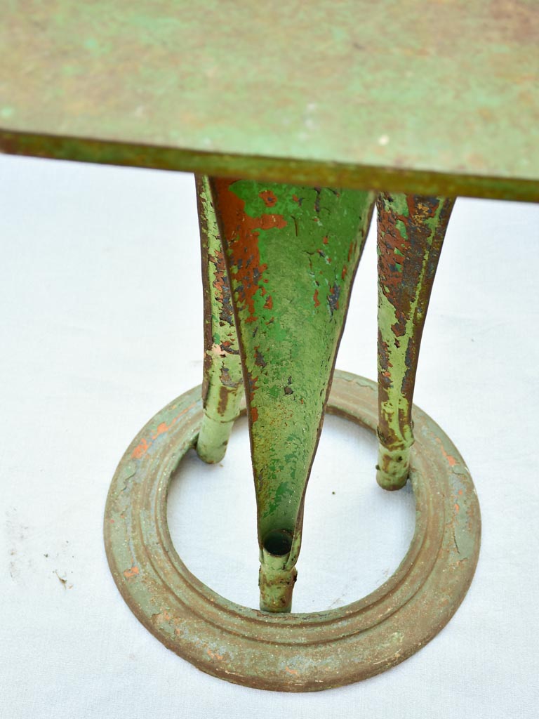 Square industrial bistro table from 1927 with green patina