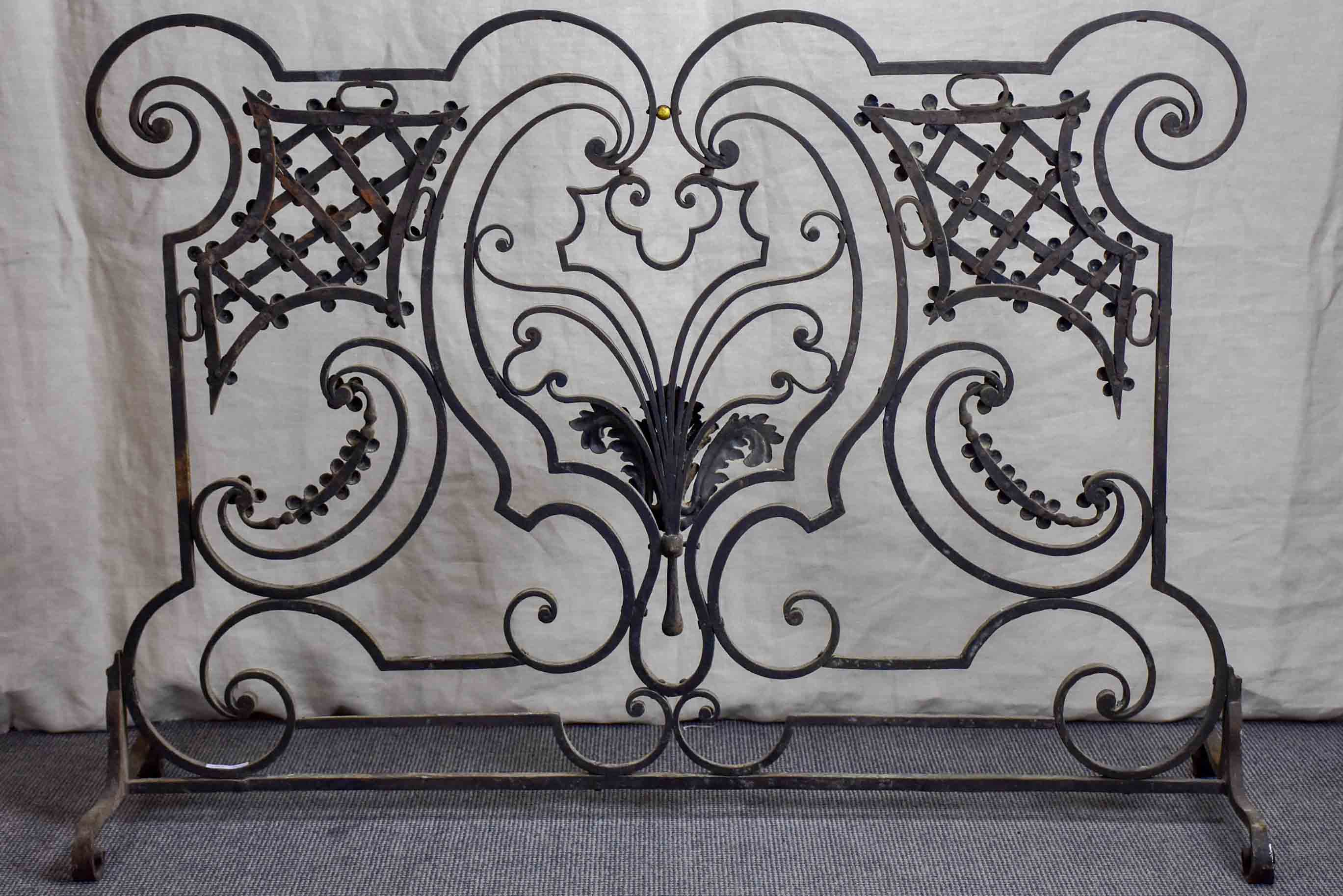 Wrought iron fire screen with flowers