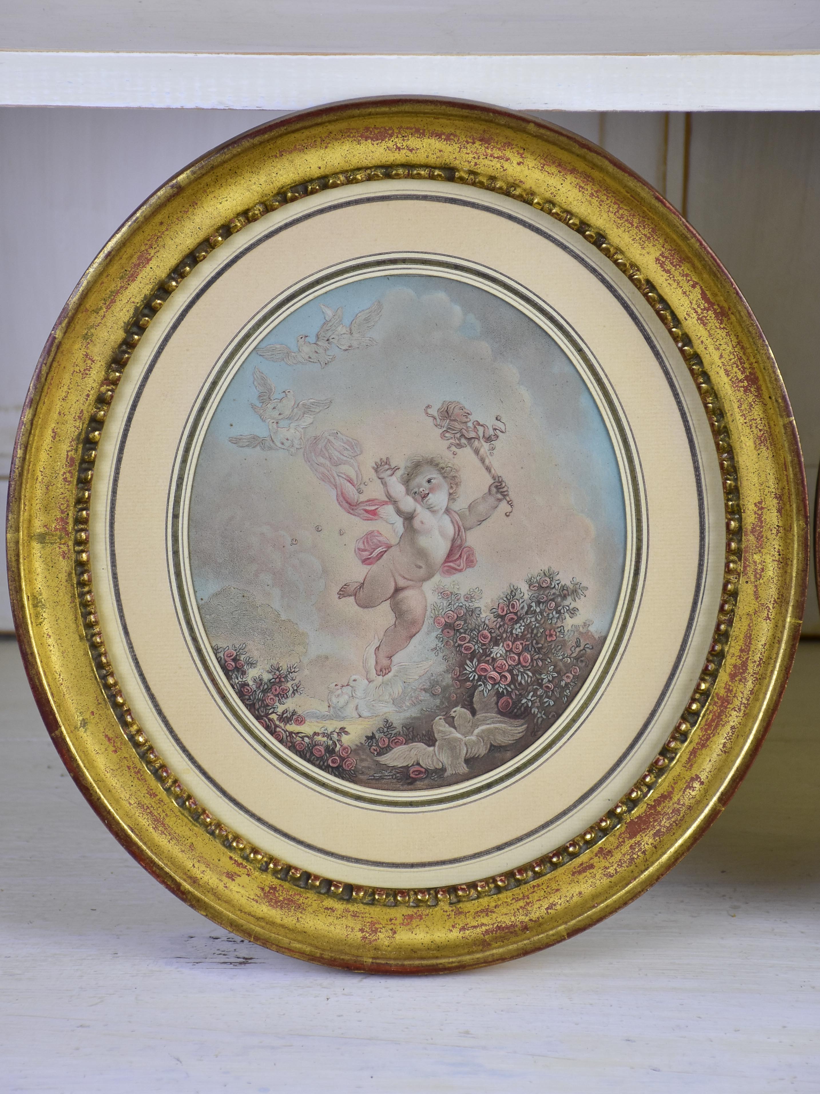 A pair of 19th century French paintings in oval frames