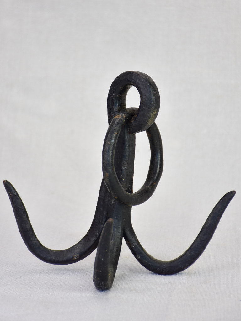 Weighty iron hooks from a water well