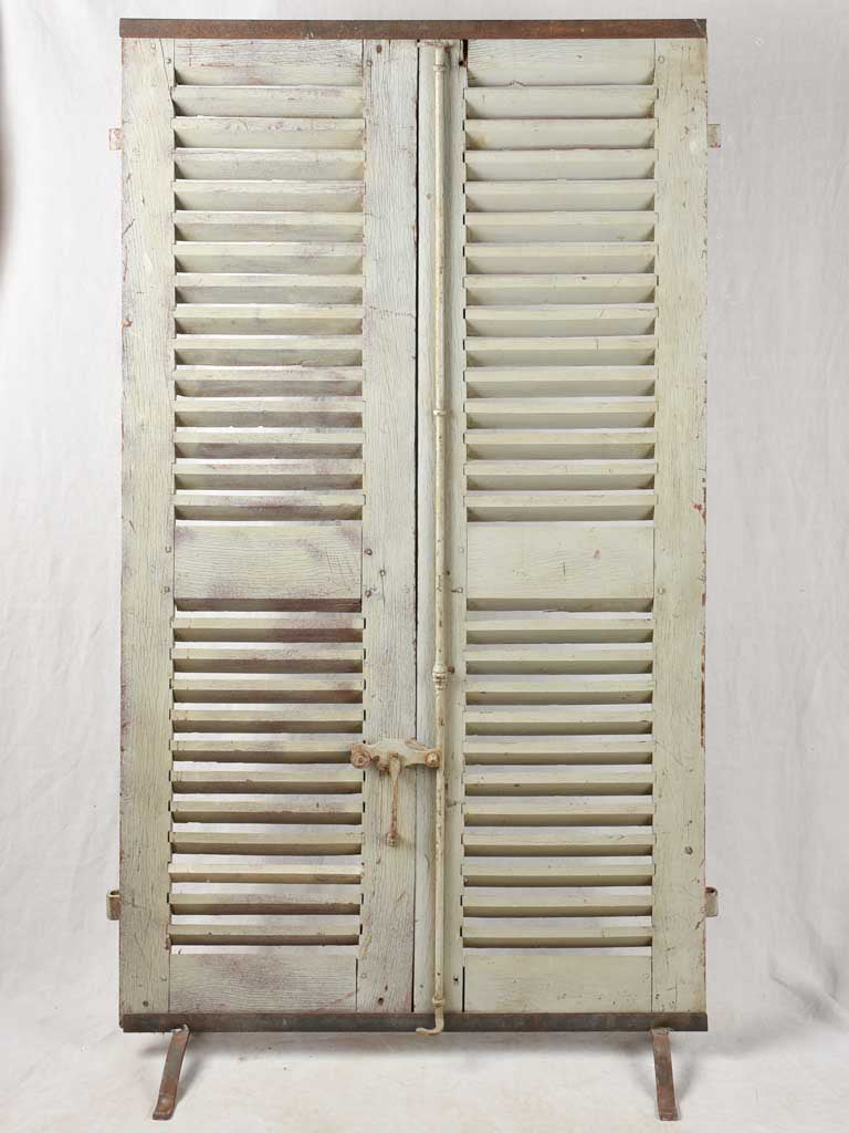 Pair of 19th century French oak shutters on stand 74¾" x 44"