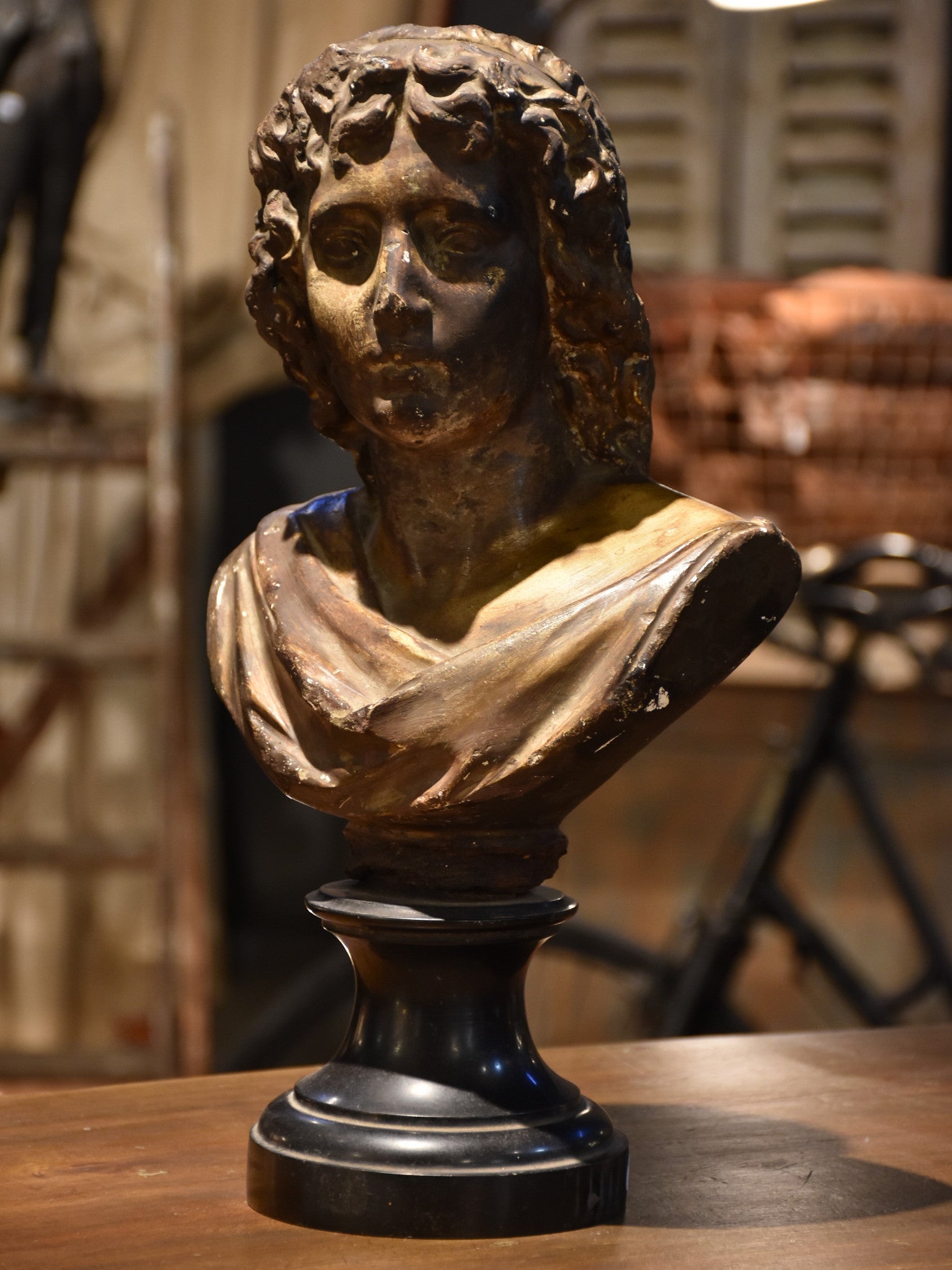 Antique bust on black marble base, 19th-century