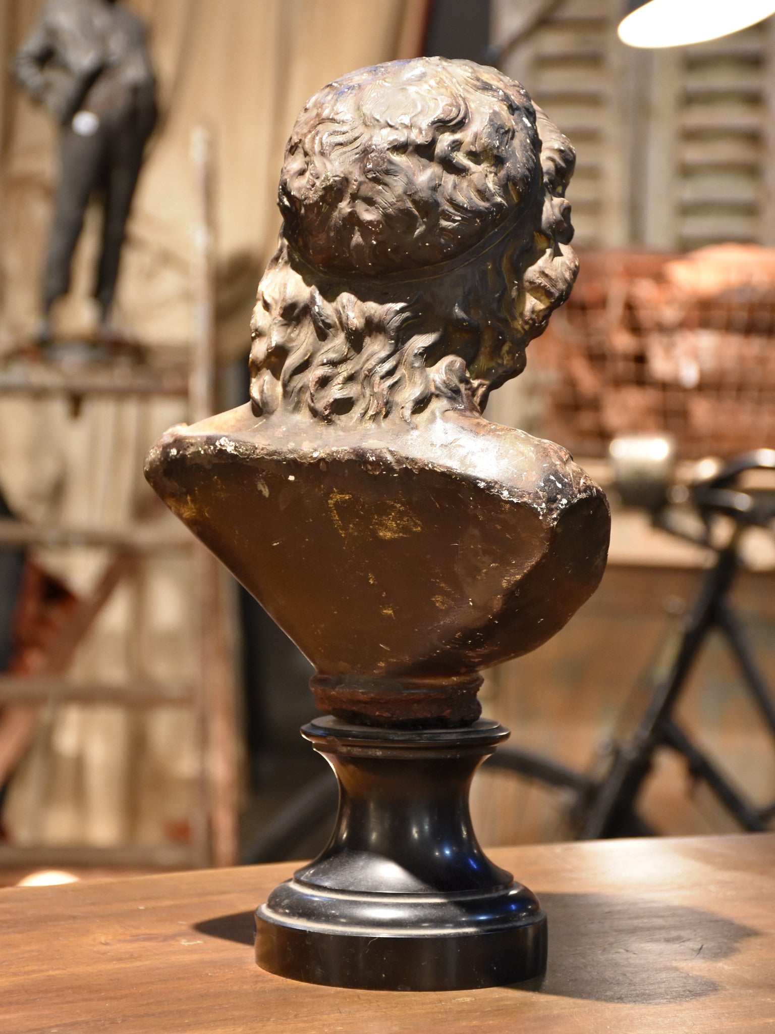 Antique bust on black marble base, 19th-century