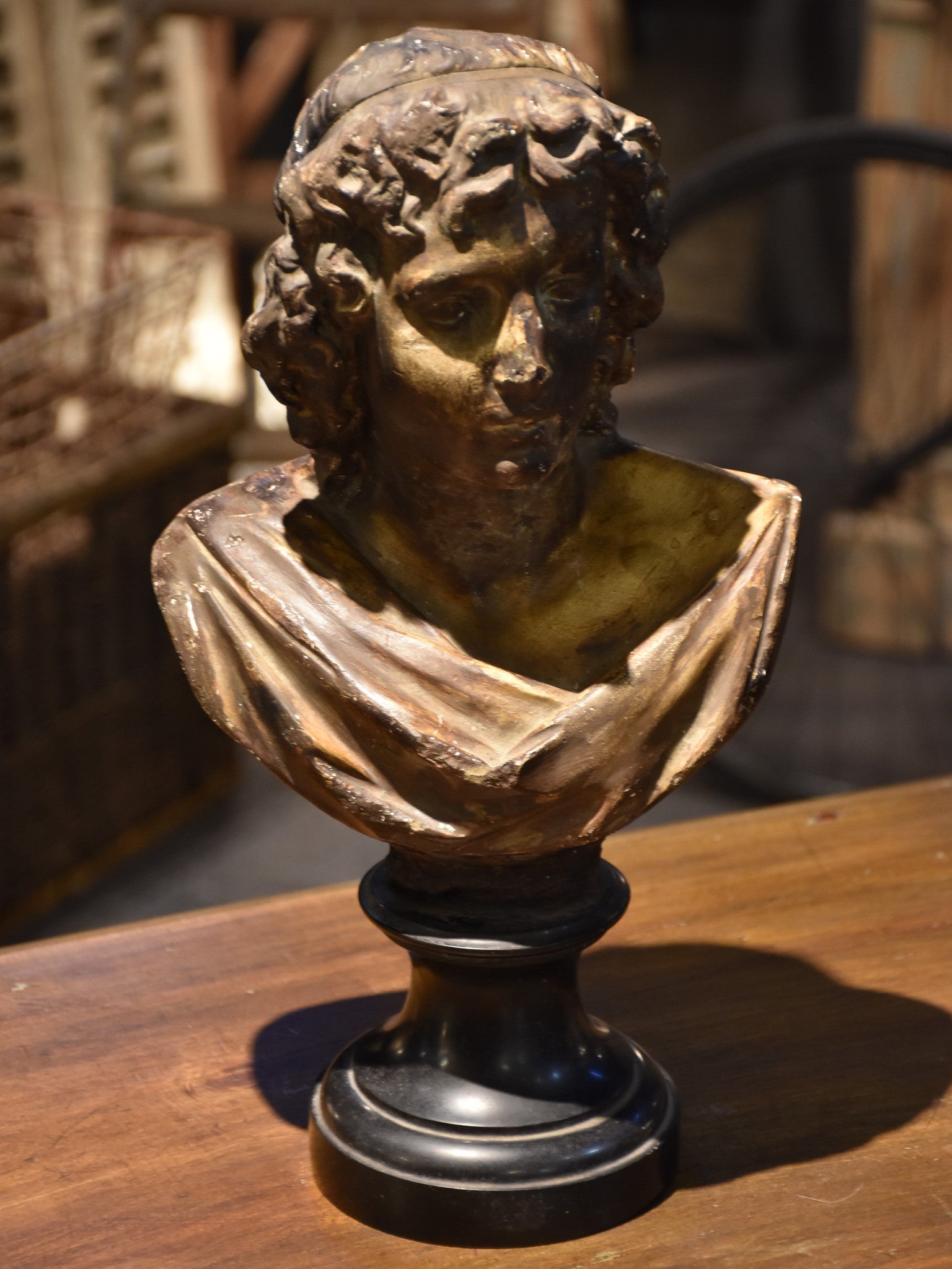 Antique bust on black marble base, 19th-century