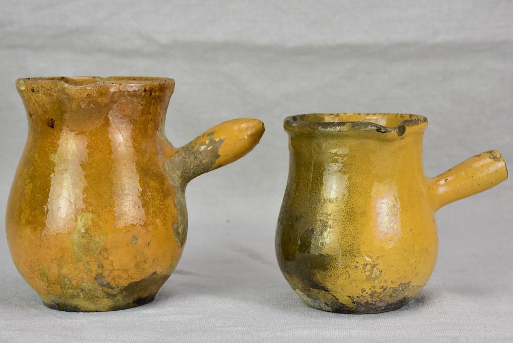 Two small antique French sauce pitchers with side handles