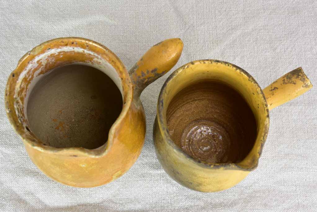 Two small antique French sauce pitchers with side handles