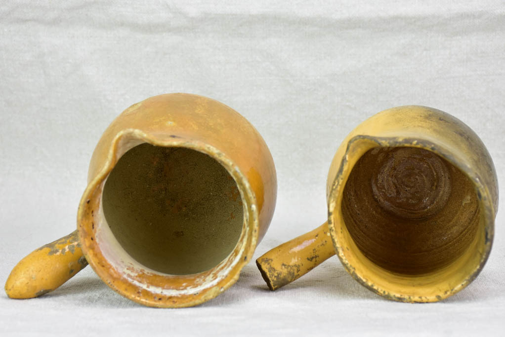 Two small antique French sauce pitchers with side handles