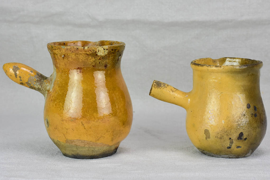 Two small antique French sauce pitchers with side handles