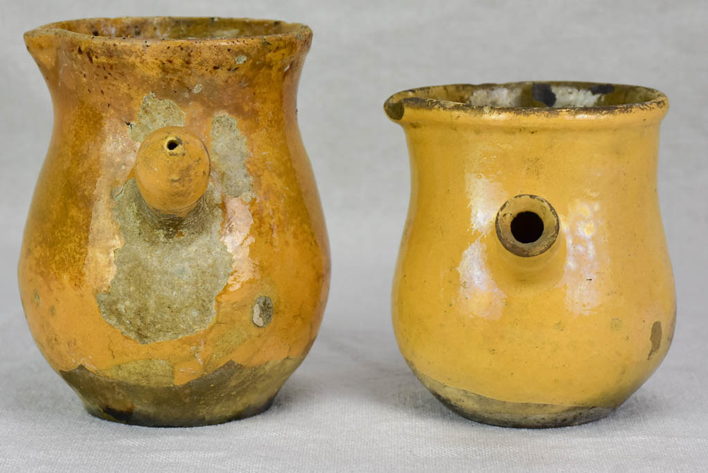 Two small antique French sauce pitchers with side handles