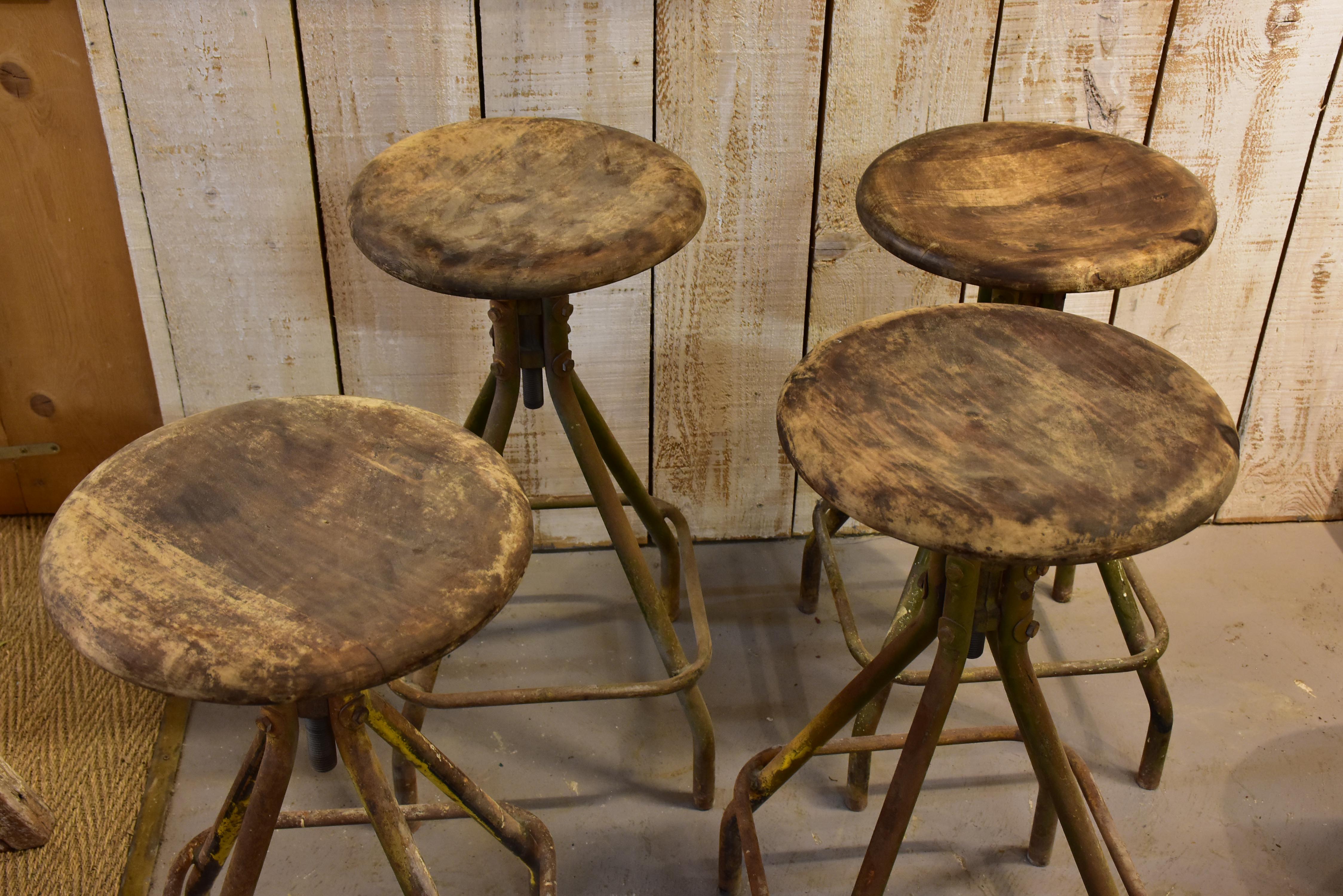 Four vintage industrial French bar stools