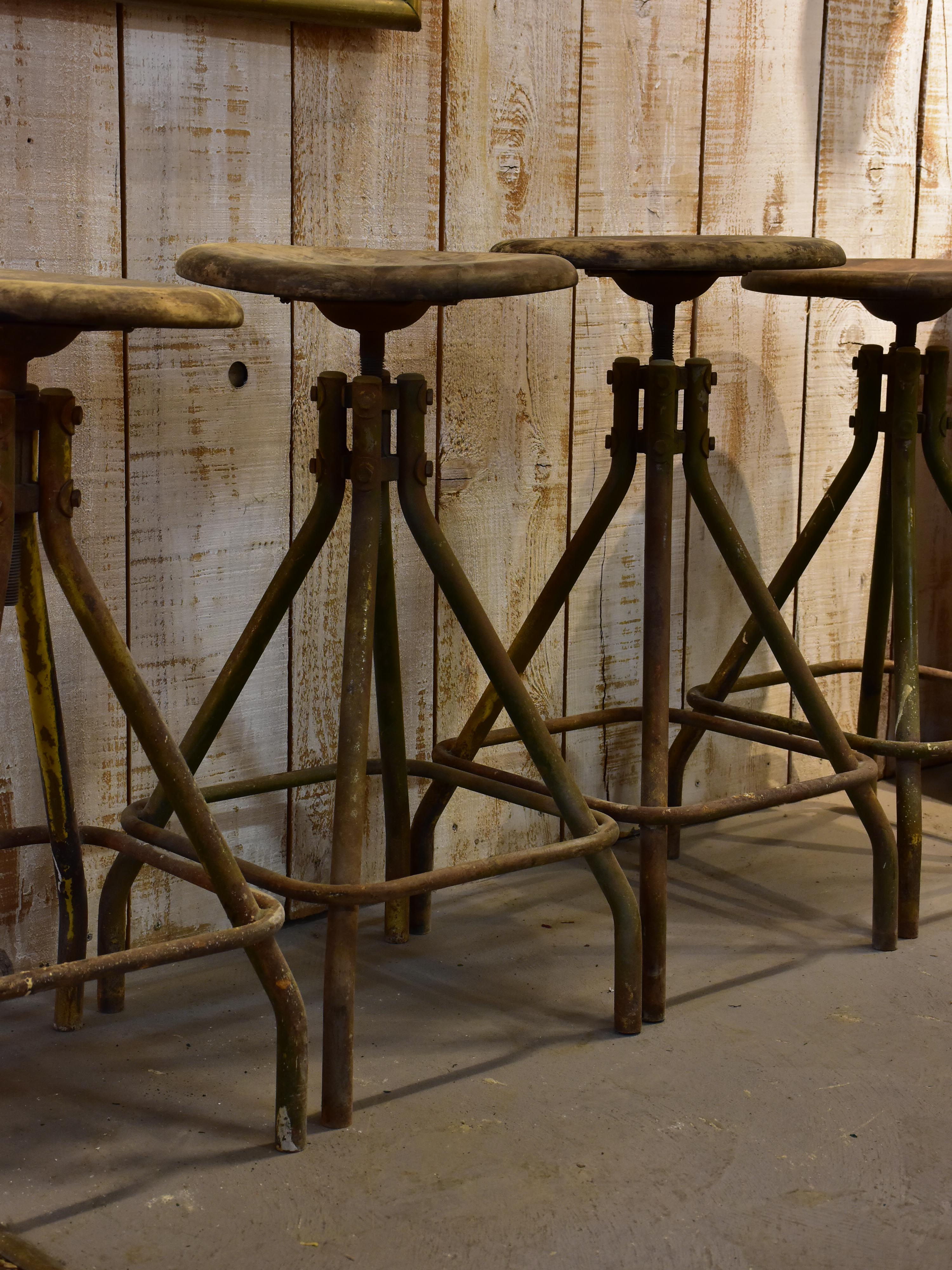 Four vintage industrial French bar stools