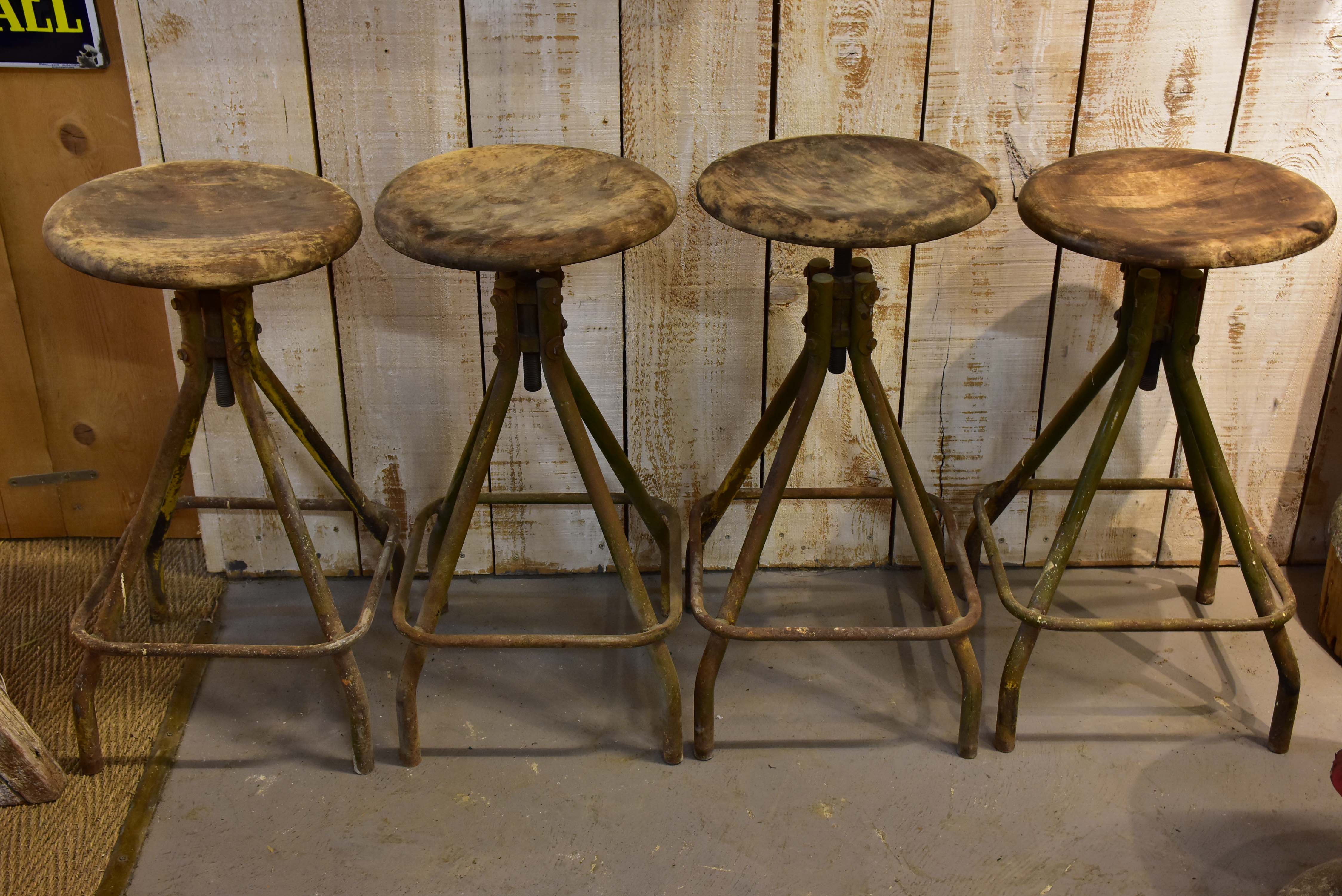 Four vintage industrial French bar stools