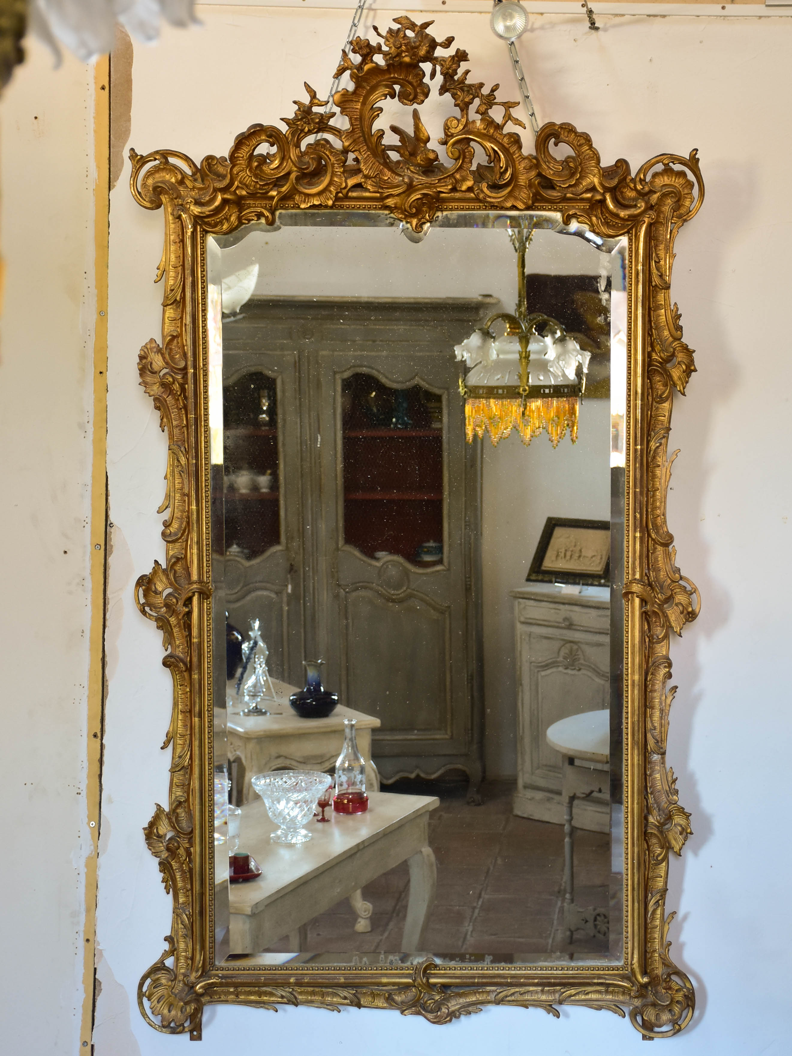 19th century Napoleon III gilded mirror with decorative crest