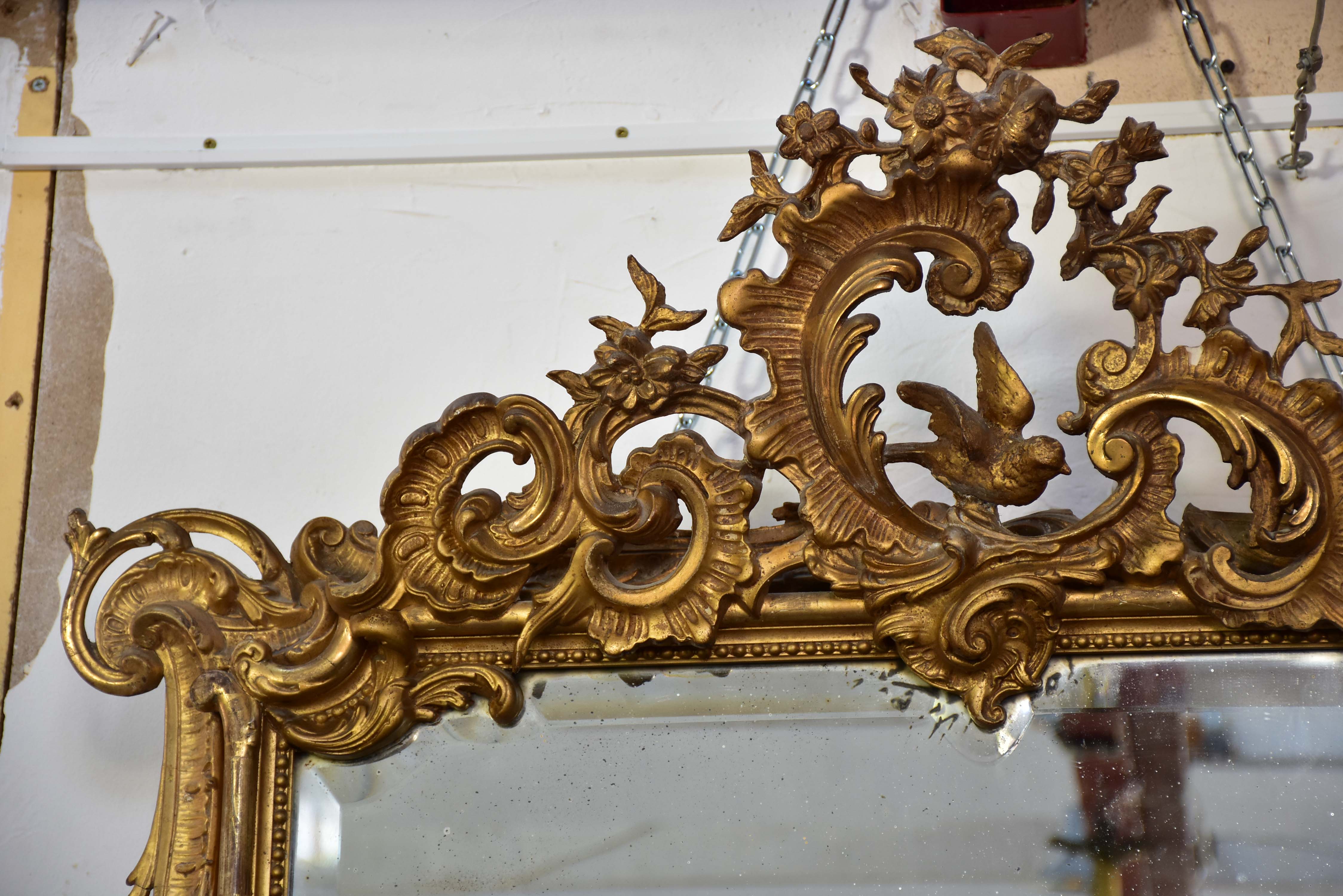 19th century Napoleon III gilded mirror with decorative crest