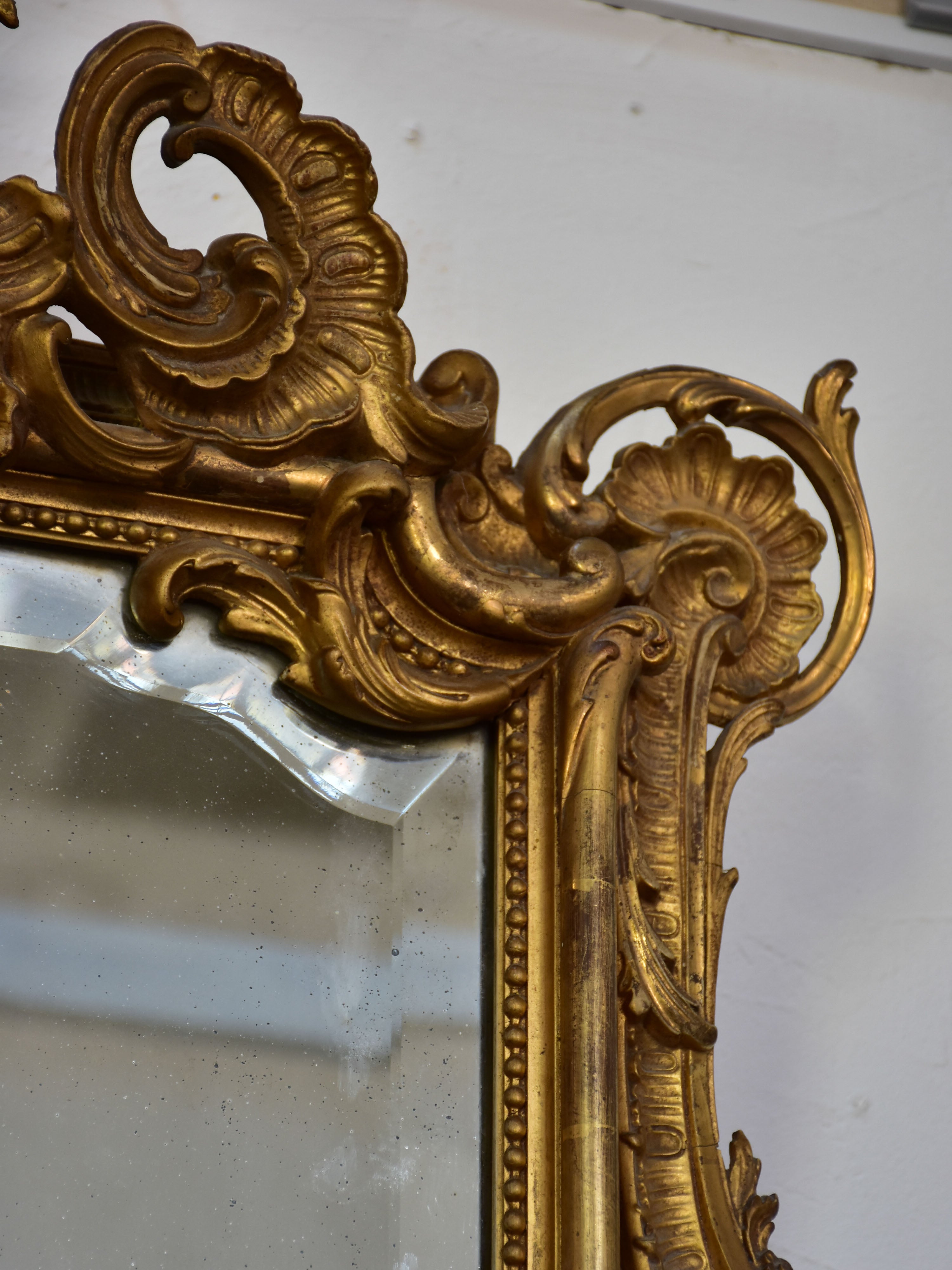 19th century Napoleon III gilded mirror with decorative crest