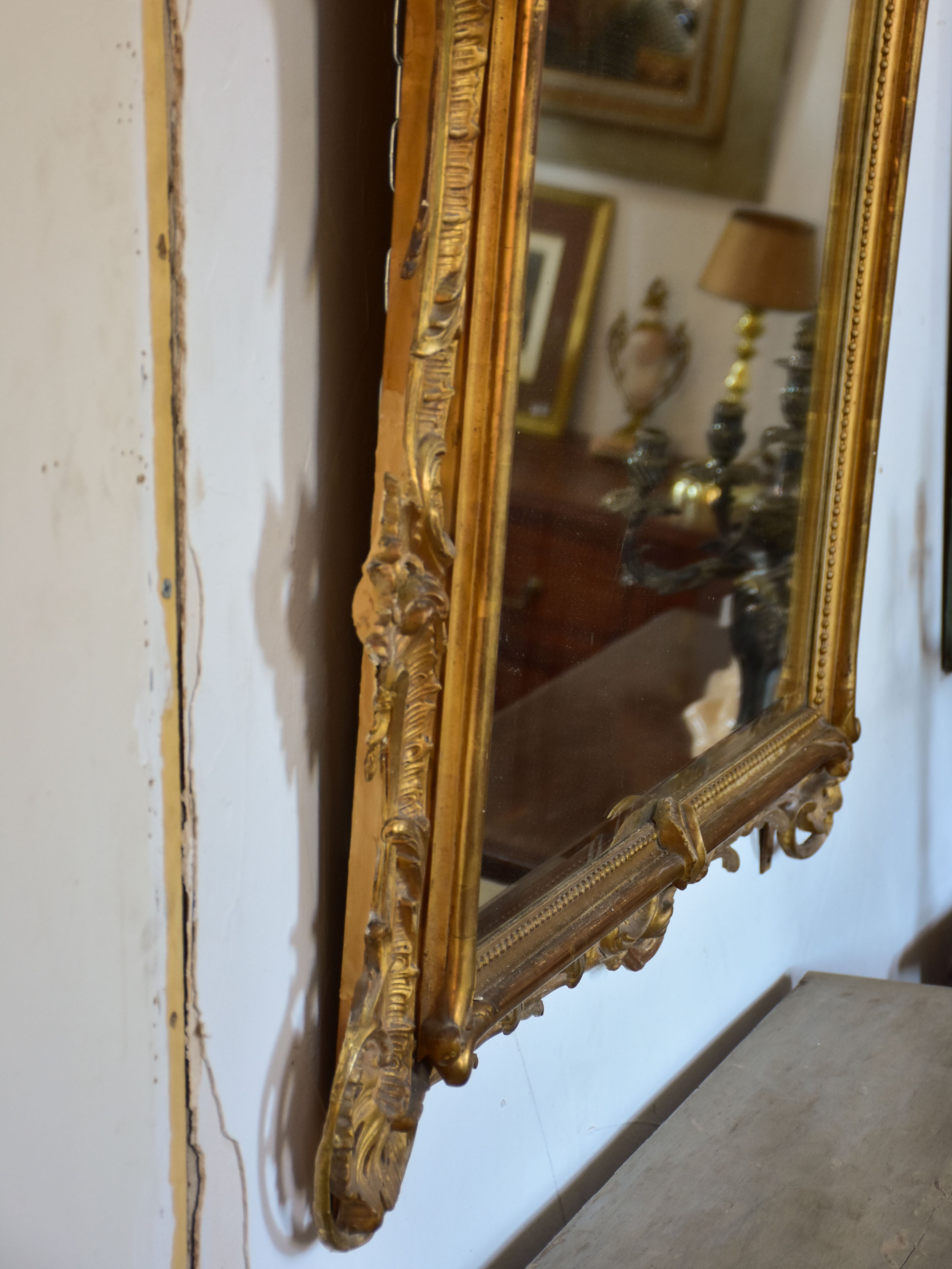 19th century Napoleon III gilded mirror with decorative crest