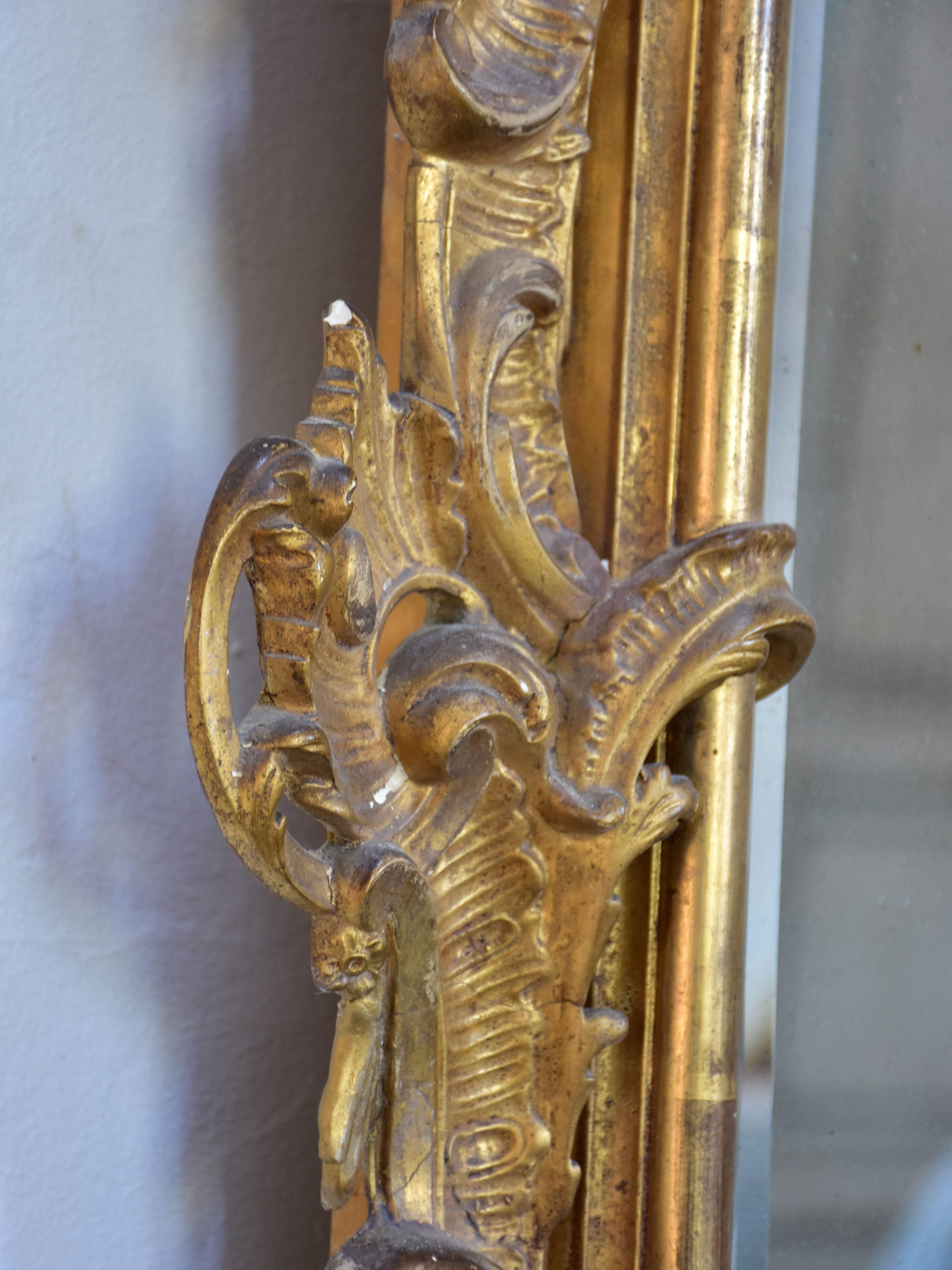 19th century Napoleon III gilded mirror with decorative crest