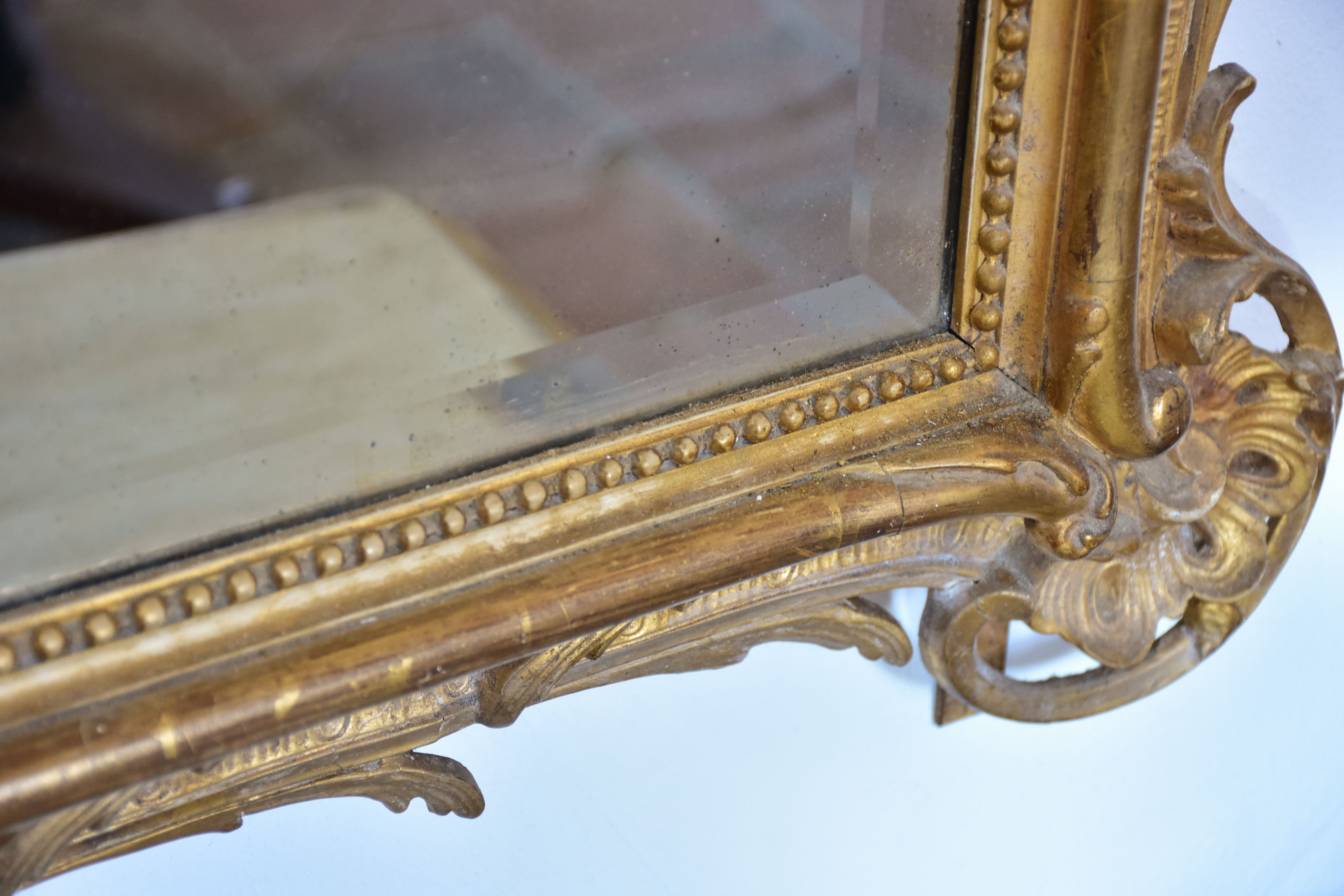 19th century Napoleon III gilded mirror with decorative crest