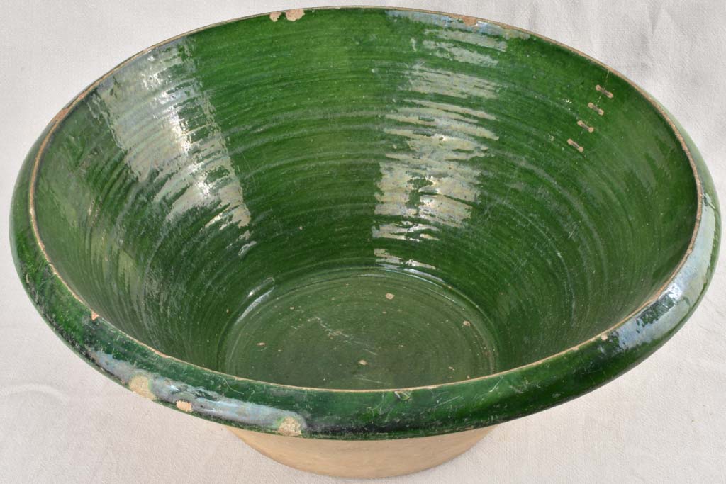 Very large Provencal tian bowl with green glaze and old repairs 24¾"