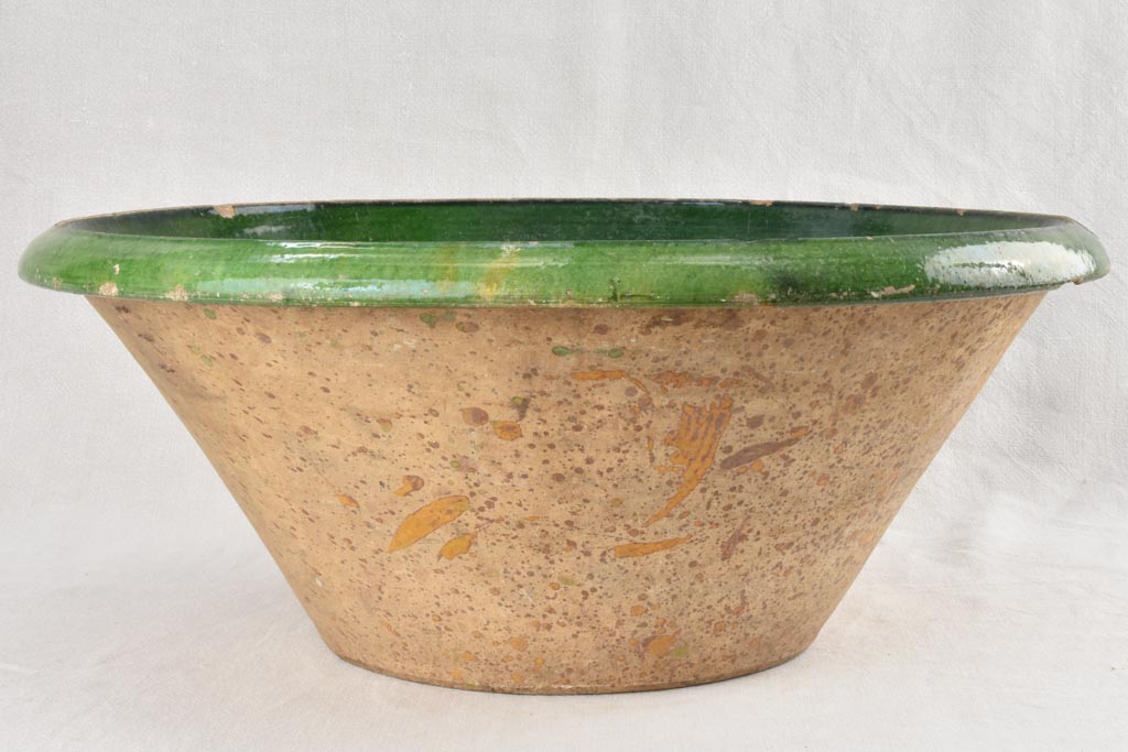 Very large Provencal tian bowl with green glaze and old repairs 24¾"