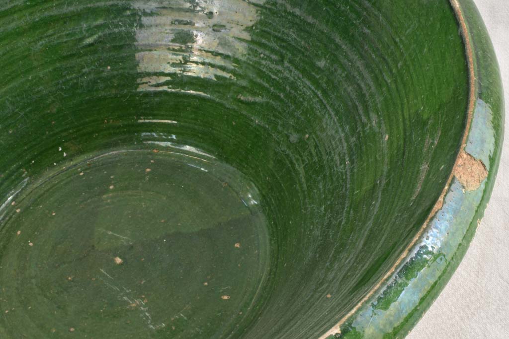 Very large Provencal tian bowl with green glaze and old repairs 24¾"