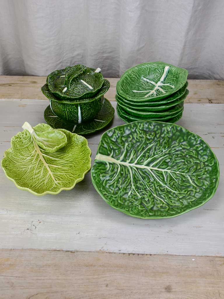 Collection of vintage cabbage leaf plates, platters and soup tureen