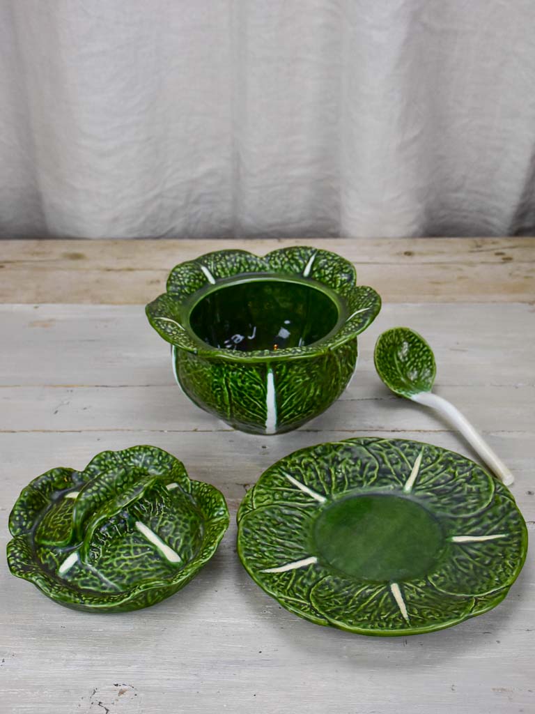 Collection of vintage cabbage leaf plates, platters and soup tureen