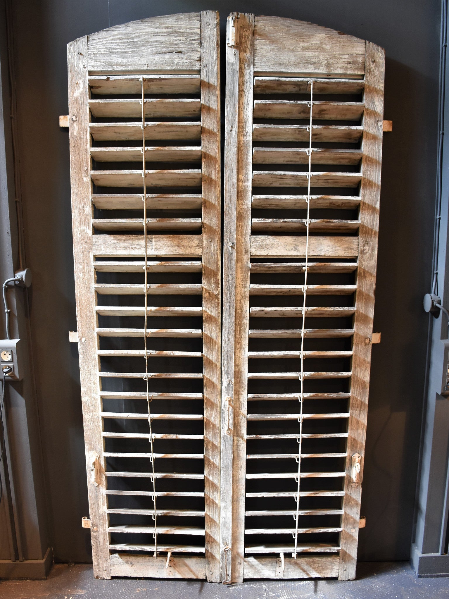 Pair of late 18th century arched oak shutters from Versailles