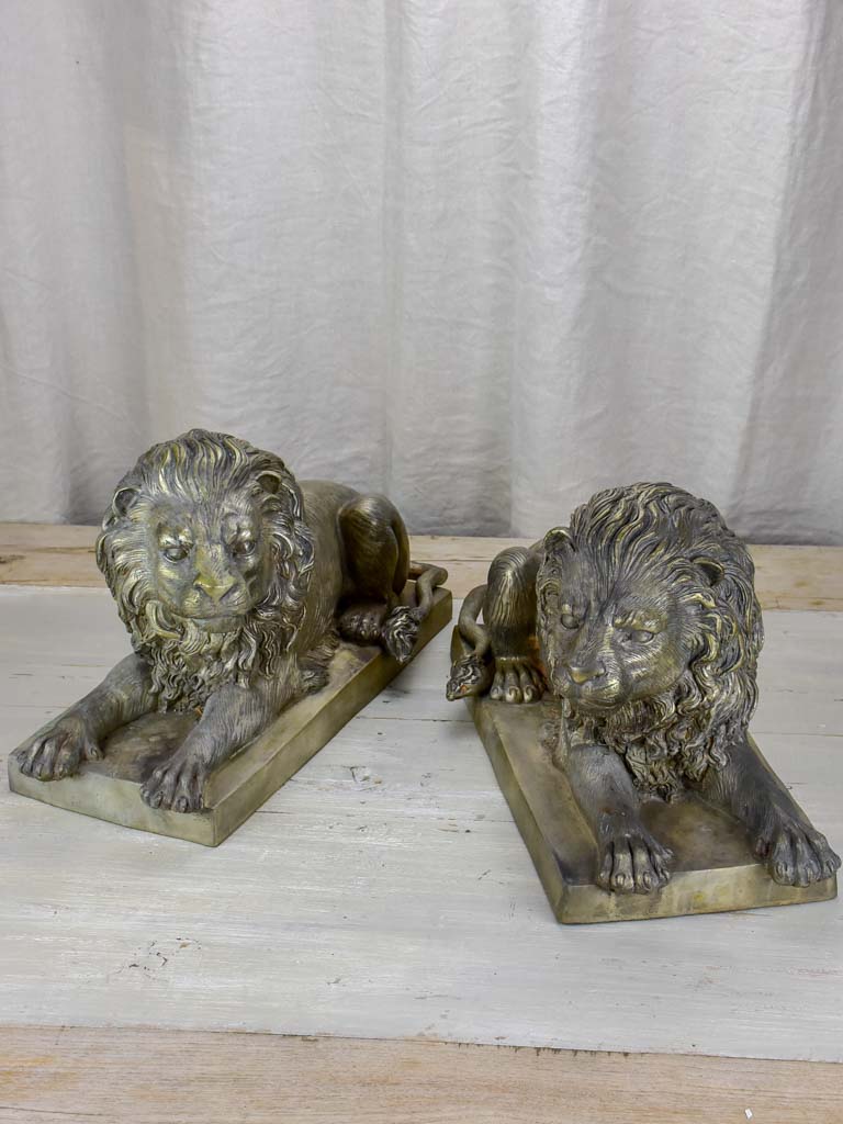 Pair of antique French lion sculptures in bronze