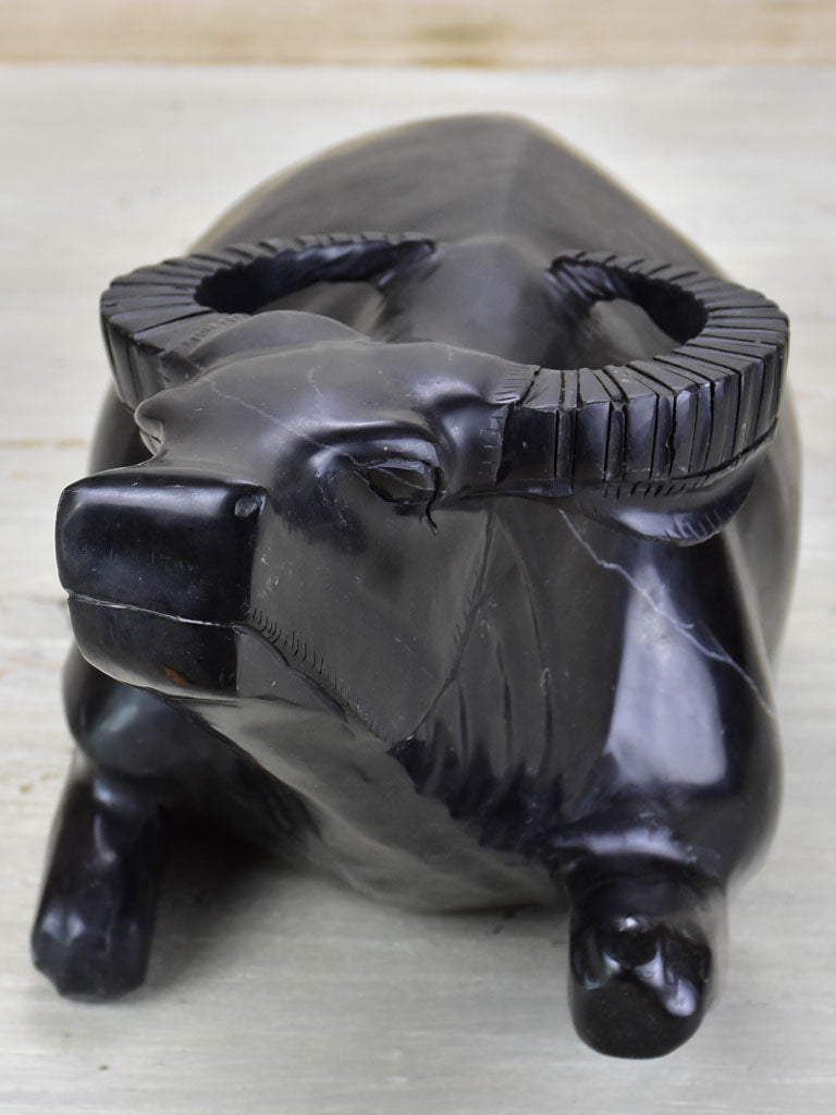 Black marble sculpture of a buffalo