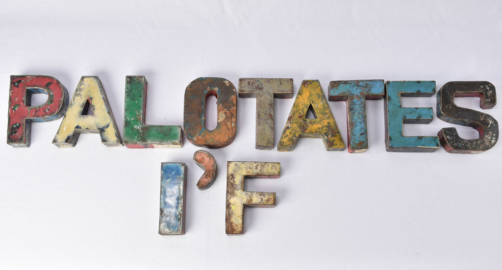 Rustic, three-dimensional, metal alphabet letters