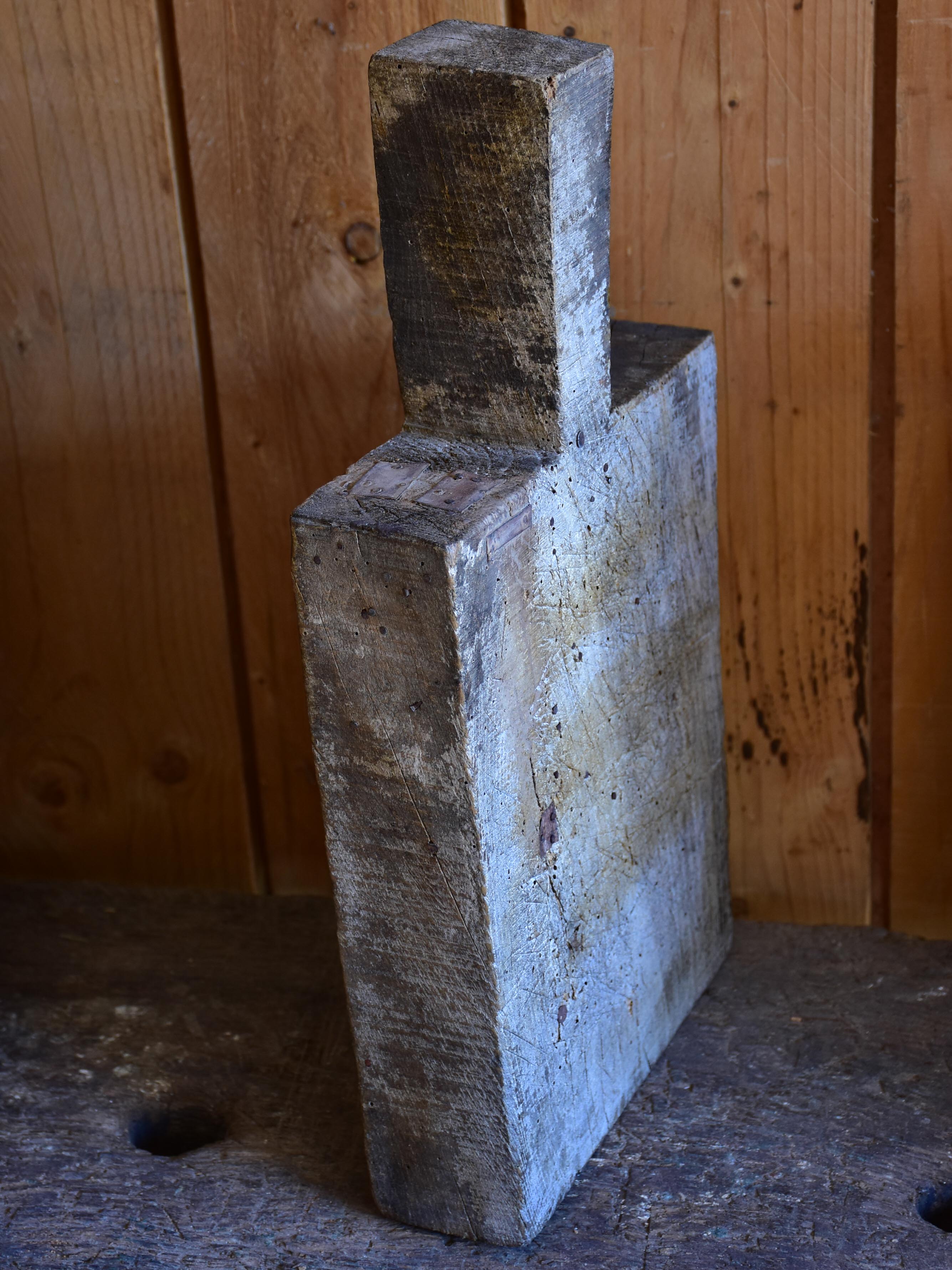 Very chunky antique French cutting board with triangular handle